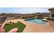Resort-style pool with lounge area, turf, and an urn for decorative appeal at 2784 Cherrydale Falls Dr, Henderson, NV 89052