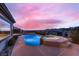 Inviting swimming pool with integrated hot tub and scenic sunset view at 2784 Cherrydale Falls Dr, Henderson, NV 89052