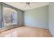 Cozy bedroom with wood floors has ample natural light streaming in from the large window at 2889 Anteres St, Las Vegas, NV 89117