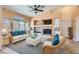 Staged living room features high ceilings, tile flooring, fireplace and cozy furniture at 2889 Anteres St, Las Vegas, NV 89117