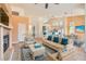 Staged living room features high ceilings, tile flooring, fireplace and cozy furniture at 2889 Anteres St, Las Vegas, NV 89117