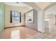 Open-concept living room with wood floors and kitchen pass-through at 2889 Anteres St, Las Vegas, NV 89117