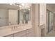 Bathroom features a vanity with a mirrored medicine cabinet and a closet at 3111 Bel Air Dr # 23A, Las Vegas, NV 89109