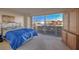 The bedroom offers a breathtaking view of the lit-up city skyline at night at 3111 Bel Air Dr # 23A, Las Vegas, NV 89109