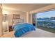 Comfortable bedroom with a balcony offering scenic city views, perfect for relaxation at 3111 Bel Air Dr # 23A, Las Vegas, NV 89109