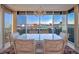 Dining area with a glass table and city views through expansive windows, perfect for elegant entertaining at 3111 Bel Air Dr # 23A, Las Vegas, NV 89109