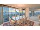 Bright eat-in dining area featuring city views, a glass table, and seating for six at 3111 Bel Air Dr # 23A, Las Vegas, NV 89109