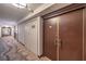 Hallway featuring apartment doors and neutral decor, leading to residential units at 3111 Bel Air Dr # 23A, Las Vegas, NV 89109