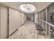 Elegant hallway with marble flooring, modern lighting fixtures, and comfortable bench seating at 3111 Bel Air Dr # 23A, Las Vegas, NV 89109