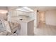 Bright, all-white kitchen with a breakfast bar and ample cabinet space at 3111 Bel Air Dr # 23A, Las Vegas, NV 89109
