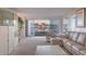Bright living room with a large sectional, balcony, and city views for modern living at 3111 Bel Air Dr # 23A, Las Vegas, NV 89109