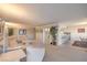 Spacious living room featuring comfortable seating, display cabinetry, and a glimpse of the dining area at 3111 Bel Air Dr # 23A, Las Vegas, NV 89109