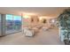 Open-concept living area featuring a large sofa, balcony access, and elegant decor at 3111 Bel Air Dr # 23A, Las Vegas, NV 89109