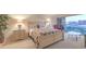 Cozy main bedroom with a view of the city skyline through sliding glass doors to a balcony at 3111 Bel Air Dr # 23A, Las Vegas, NV 89109