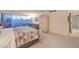 Bright main bedroom featuring city views, an armoire, a sofa, and neutral carpet at 3111 Bel Air Dr # 23A, Las Vegas, NV 89109