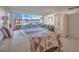 Bright main bedroom featuring city views, an armoire, a sofa, and a southwestern-style bed at 3111 Bel Air Dr # 23A, Las Vegas, NV 89109
