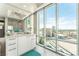 Modern bathroom featuring a double sink vanity, a glass shower, and stunning city views at 322 Karen Ave # 2201, Las Vegas, NV 89109