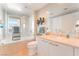 Bright bathroom featuring a soaking tub, glass shower, and modern fixtures at 322 Karen Ave # 2201, Las Vegas, NV 89109