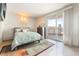 Serene bedroom with a comfortable bed, neutral decor, and balcony access with city views at 322 Karen Ave # 2201, Las Vegas, NV 89109