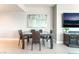 Stylish dining area with a glass table, modern chairs, and contemporary artwork at 322 Karen Ave # 2201, Las Vegas, NV 89109