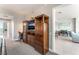 Hallway with built-in entertainment center, desk, and access to the bathroom and living area at 322 Karen Ave # 2201, Las Vegas, NV 89109