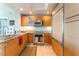 Modern kitchen with stainless steel appliances, granite countertops, and light wood cabinets at 322 Karen Ave # 2201, Las Vegas, NV 89109