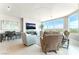 Bright living room with comfortable seating, a city view, and modern lighting at 322 Karen Ave # 2201, Las Vegas, NV 89109