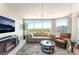 Living room boasts large windows with city views, a comfortable sofa, and modern decor at 322 Karen Ave # 2201, Las Vegas, NV 89109