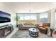 Bright living room featuring floor to ceiling windows with panoramic views, comfortable seating, and modern fireplace at 322 Karen Ave # 2201, Las Vegas, NV 89109