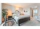 Comfortable main bedroom with a king-sized bed, nightstands, and wall decorations at 322 Karen Ave # 2201, Las Vegas, NV 89109