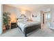 Comfortable main bedroom with a king-sized bed, nightstands, and wall decorations at 322 Karen Ave # 2201, Las Vegas, NV 89109