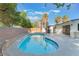 Lush backyard oasis highlighting a beautiful pool and serene landscaping at 3320 Osage Ave, Las Vegas, NV 89101