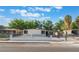 Inviting single-story home featuring xeriscape landscaping, secure fencing, and covered parking at 3320 Osage Ave, Las Vegas, NV 89101