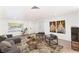 Staged living room showcasing contemporary furniture, wood-look flooring, and ample natural light at 3320 Osage Ave, Las Vegas, NV 89101