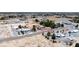 Aerial view of the property within a desert community, showcasing landscaping and nearby homes at 3360 National Ave, Pahrump, NV 89048