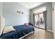 Bright bedroom with a sliding glass door and access to a backyard patio area at 3360 National Ave, Pahrump, NV 89048
