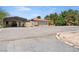 Front yard featuring desert landscaping, parking and a covered carport at 3360 National Ave, Pahrump, NV 89048