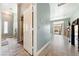 Inviting hallway with wood floors leading to an open living area and backyard access at 3360 National Ave, Pahrump, NV 89048