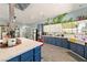 Bright kitchen with a large center island, custom cabinets, and modern appliances at 3360 National Ave, Pahrump, NV 89048