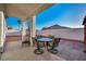 Outdoor patio with ample seating under a covered area, offering a relaxing backyard space at 4005 Poppy Fields Dr, Las Vegas, NV 89129