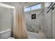 Bathroom featuring a bathtub with marble surround and shower at 4005 Poppy Fields Dr, Las Vegas, NV 89129