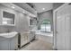 Bathroom with dual sinks, bath and natural light from window at 4005 Poppy Fields Dr, Las Vegas, NV 89129