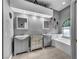 Bathroom with dual sinks, bath and natural light from window at 4005 Poppy Fields Dr, Las Vegas, NV 89129