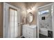 Bathroom features a vanity, mirror, and tiled walk-in shower at 4005 Poppy Fields Dr, Las Vegas, NV 89129