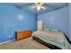 Bedroom with carpet flooring, ceiling fan, and dresser storage at 4005 Poppy Fields Dr, Las Vegas, NV 89129
