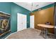 Vibrant room complemented by a round table, chairs, and a sports themed wall decor at 4005 Poppy Fields Dr, Las Vegas, NV 89129
