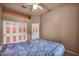 Bright bedroom with closet space and ceiling fan for comfort at 4005 Poppy Fields Dr, Las Vegas, NV 89129