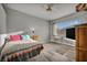 Comfortable bedroom with a large window, ceiling fan, and ample sunlight at 4005 Poppy Fields Dr, Las Vegas, NV 89129