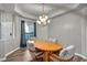 Features an elegant dining area with wood floors and a decorative chandelier at 4005 Poppy Fields Dr, Las Vegas, NV 89129