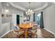 Features an elegant dining area with wood floors and a decorative chandelier at 4005 Poppy Fields Dr, Las Vegas, NV 89129
